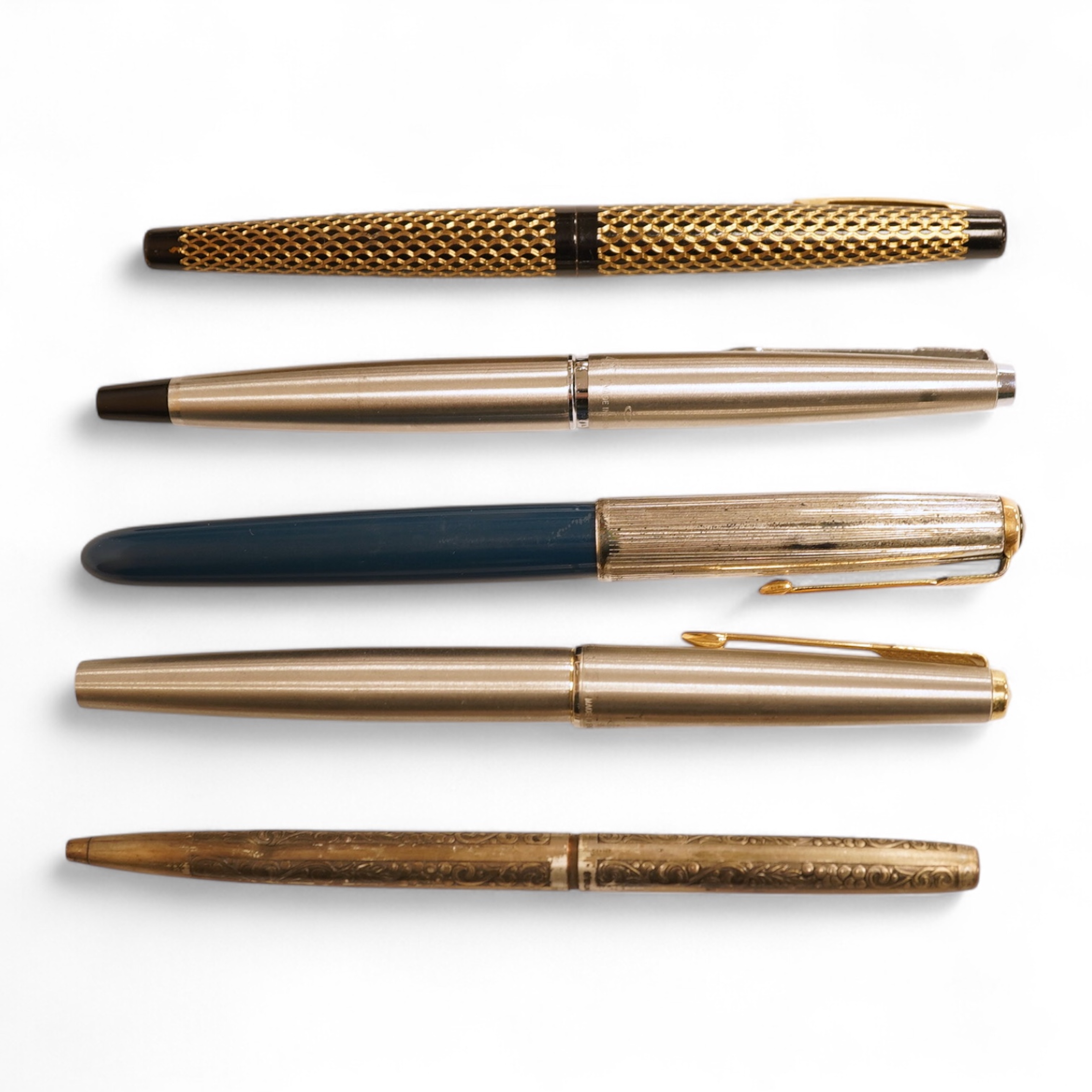 A Sheaffer 'White Spot' fountain pen with 14K gold nib and chevron decoration and three other pens